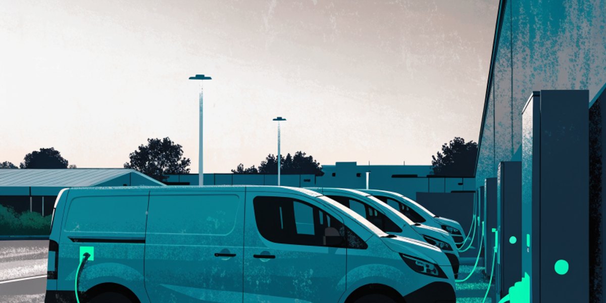 Electric panel vans charging at a depot